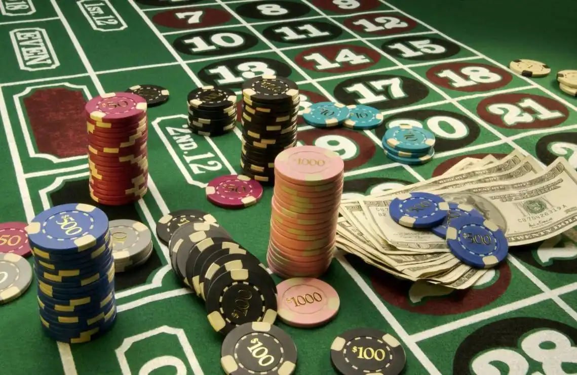 Colorful online slot game reels displayed on a mobile phone for Filipino players on tropawin